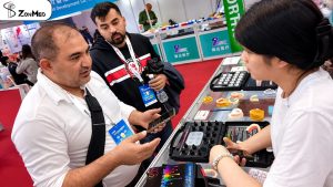 Visitors examining ZONMED samples with booth staff at DenTech China 2026