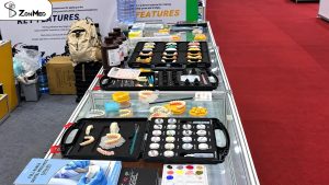 Polyfix stain kit, brochures and printed models on the ZONMED sample table at DenTech China 2026